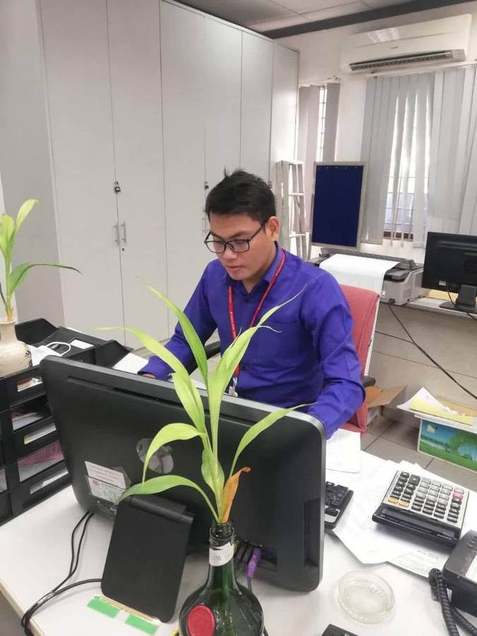 Lysong Sun working at his desk